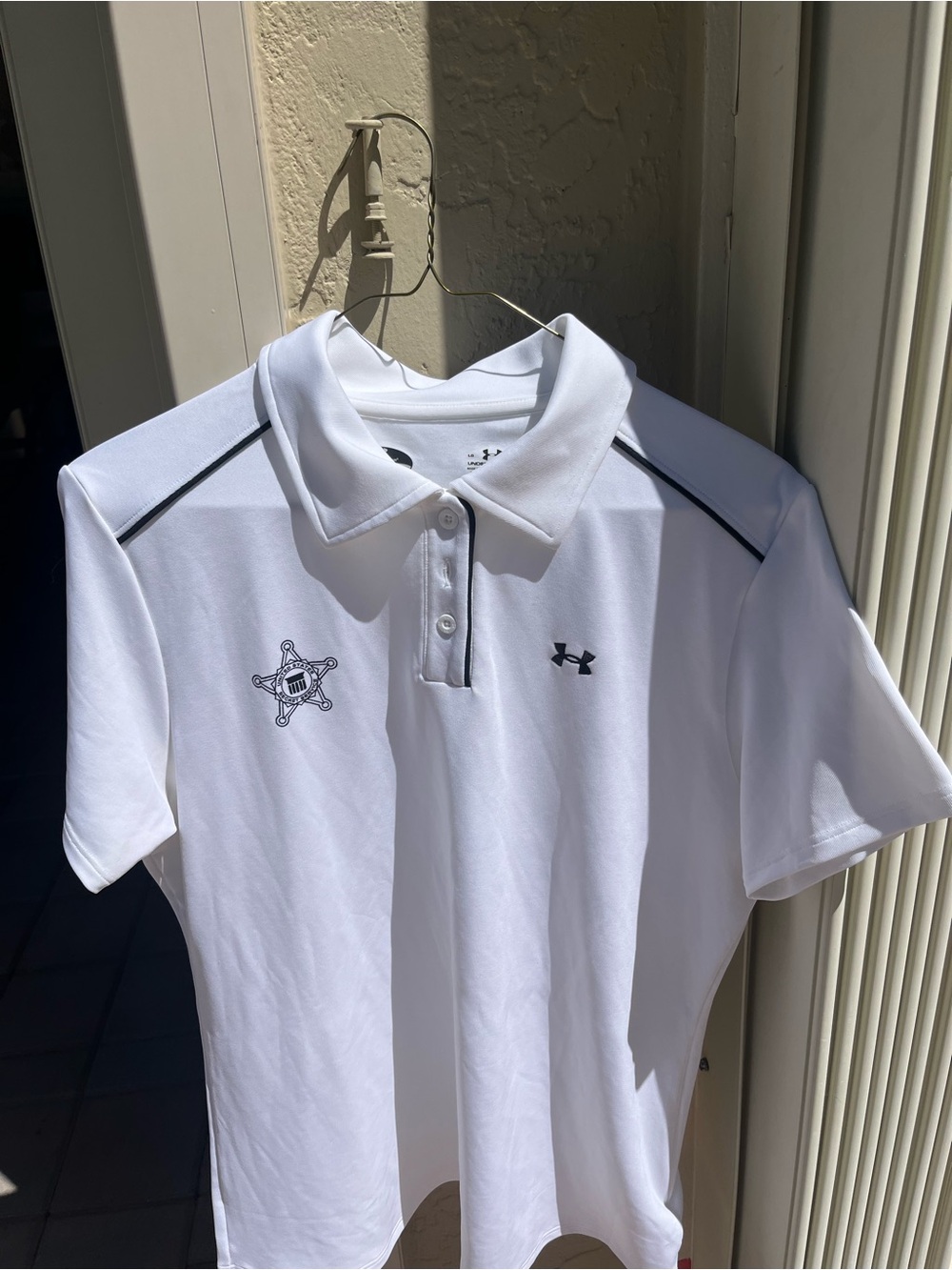 Under Armour White Polo with Black Accents and Chest Badge